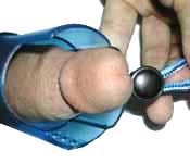 The device is tighten somewhat around the head to hold penis in place.